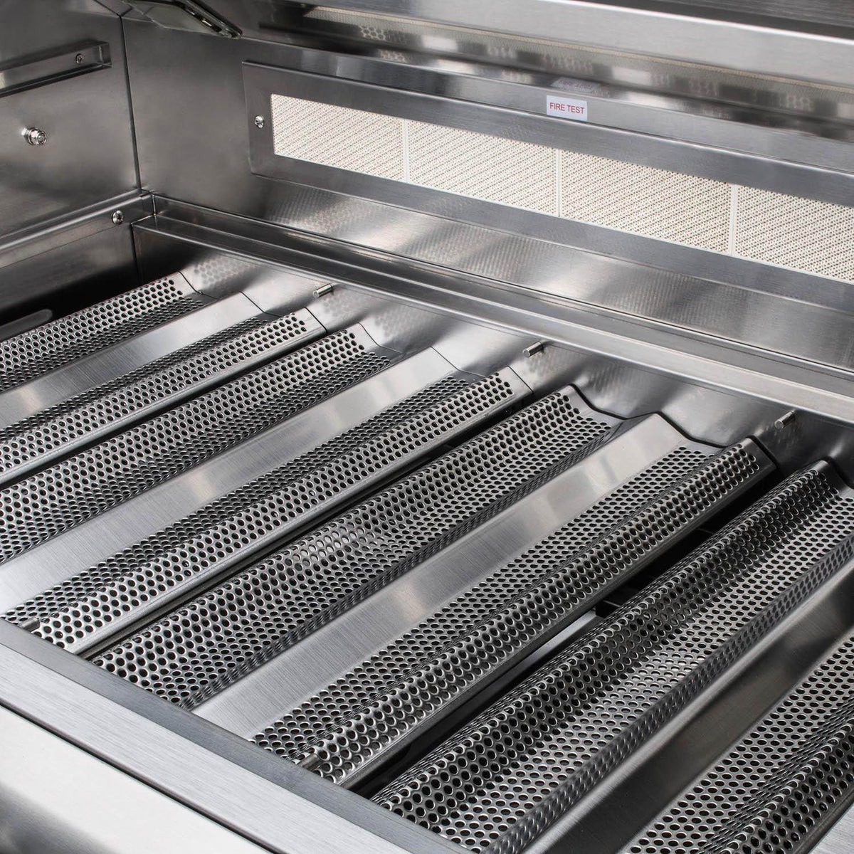 Stainless steel cooking grates inside built-in propane grill firebox