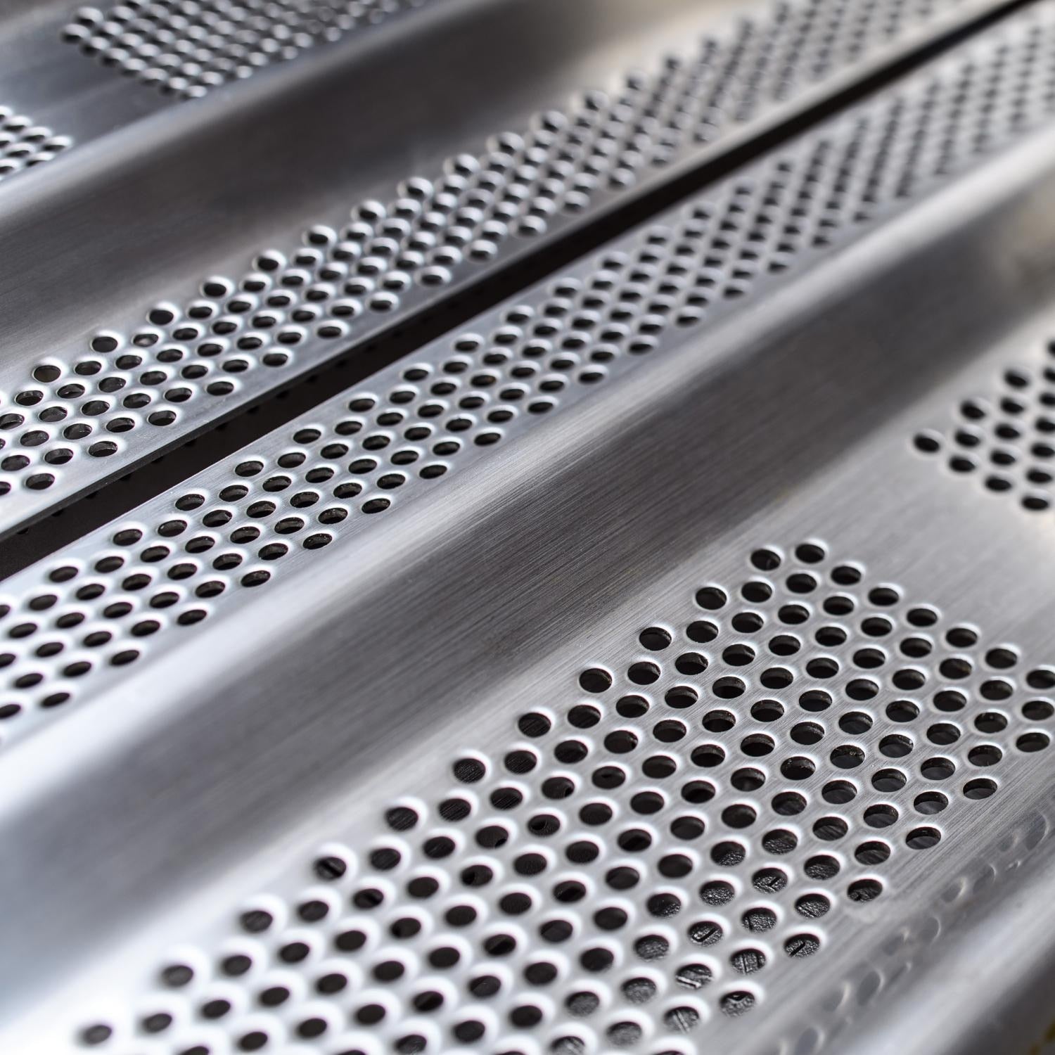 Perforated warming rack surface on stainless steel gas grill