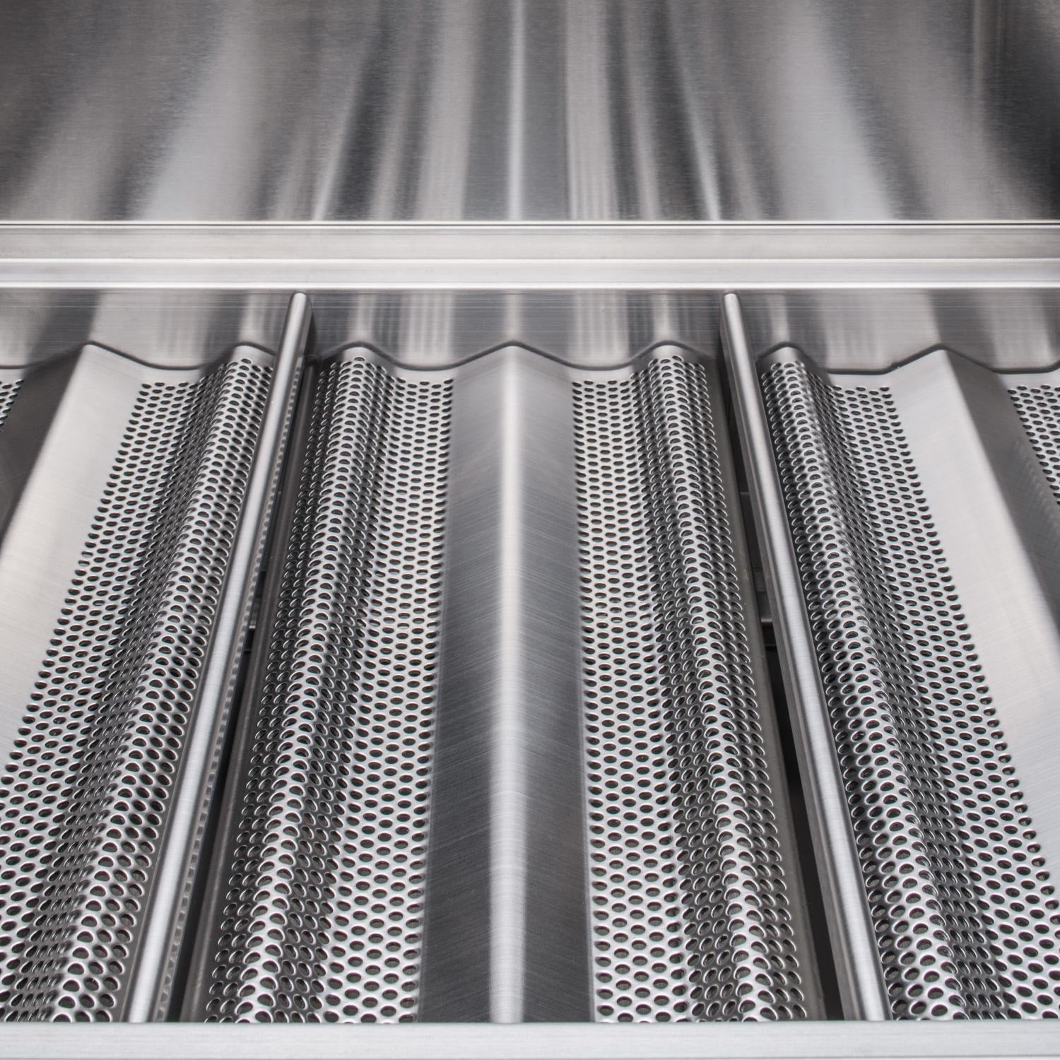 Stainless gas grill burner shield with rows of perforated heat plates