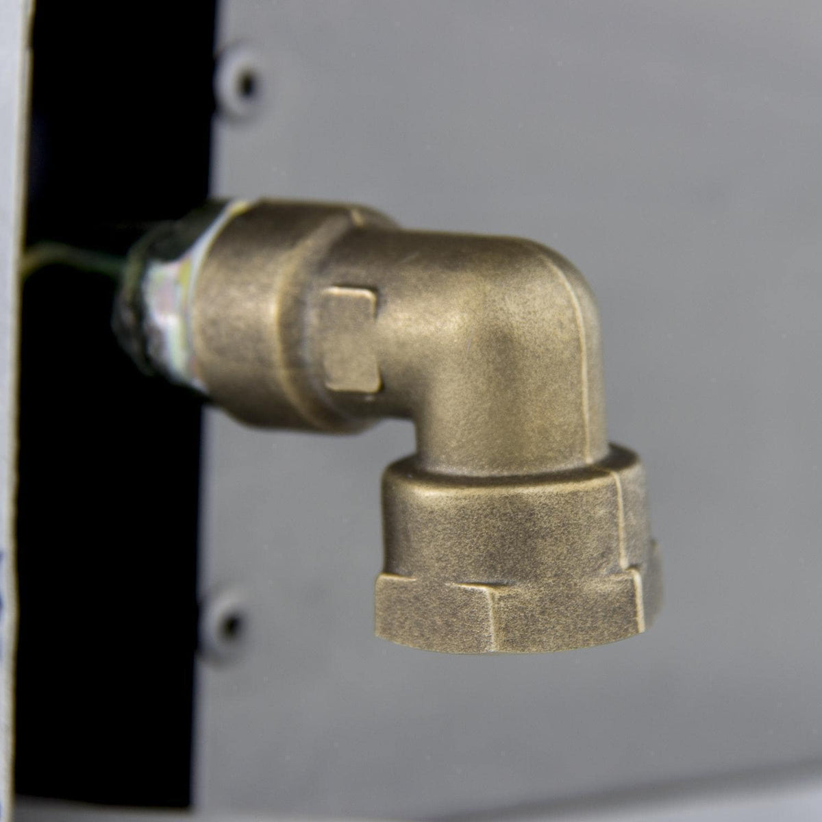 Brass gas valve elbow fitting with threaded connection on metal housing