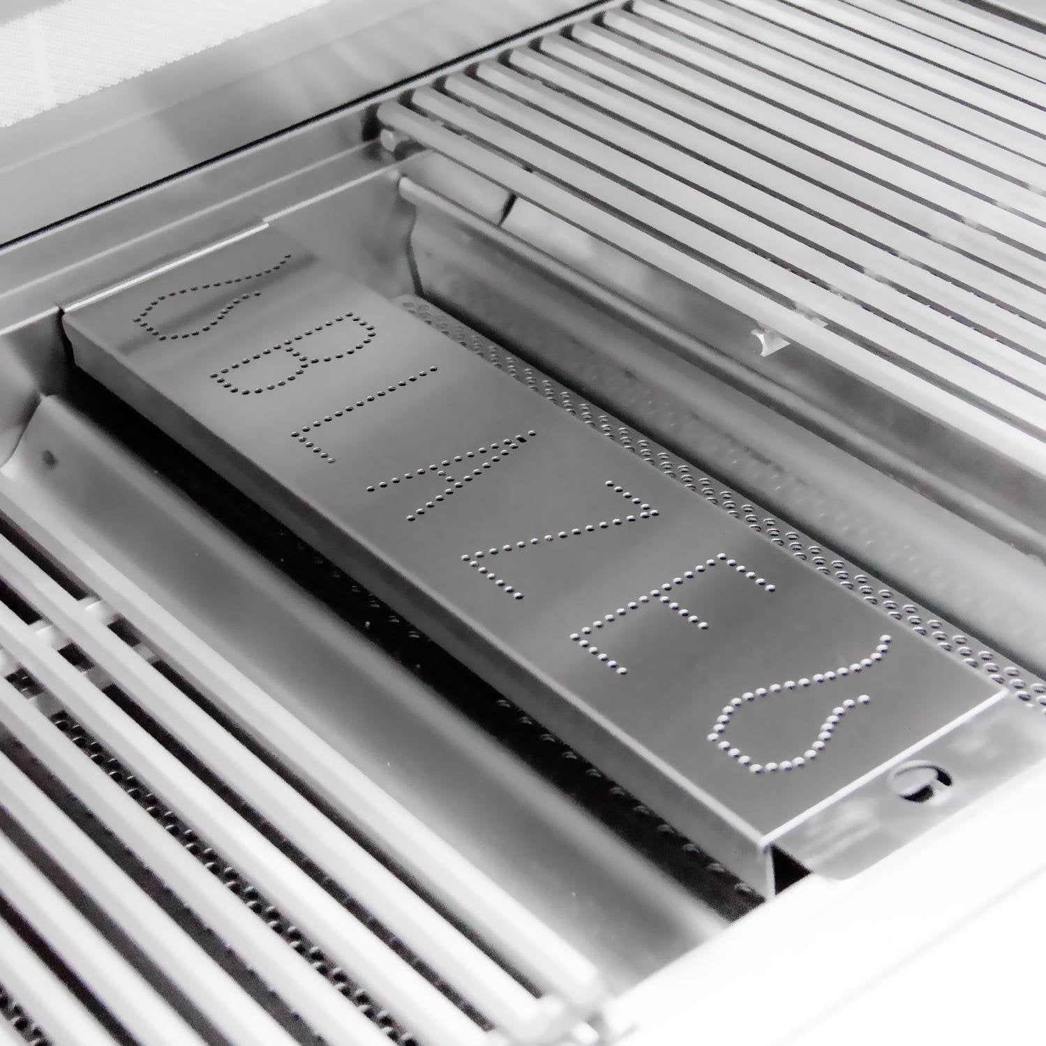 Stainless steel smoker box placed on grill grates with perforated lid