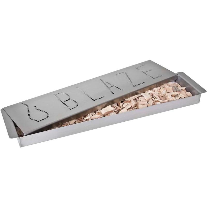Stainless steel smoker box open with wood chips and dotted lid markings