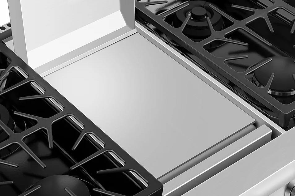Stainless steel natural gas cooktop with black burner grates and rectangular center burner area