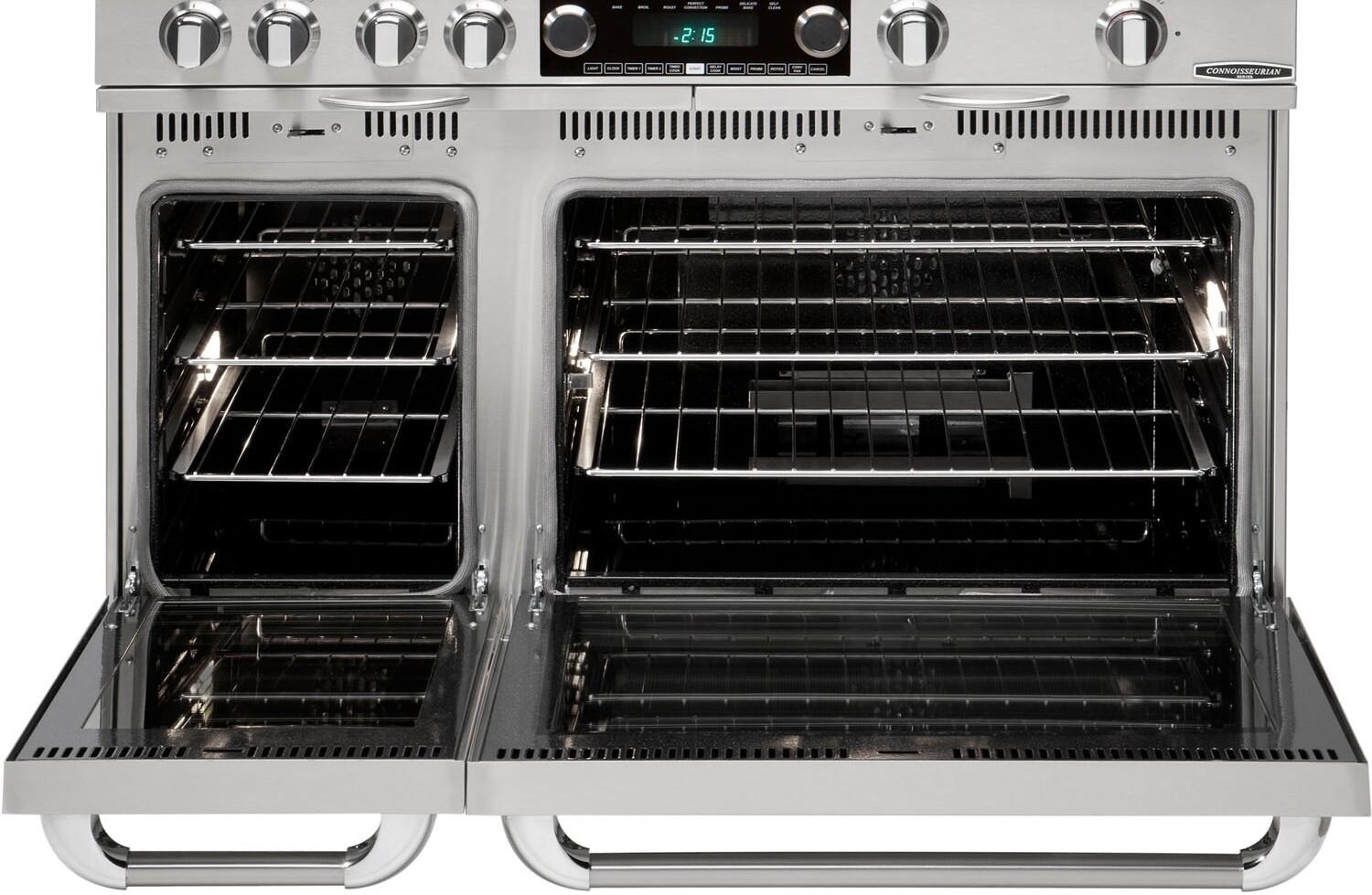 Open dual fuel range with two ovens showing racks and black interiors