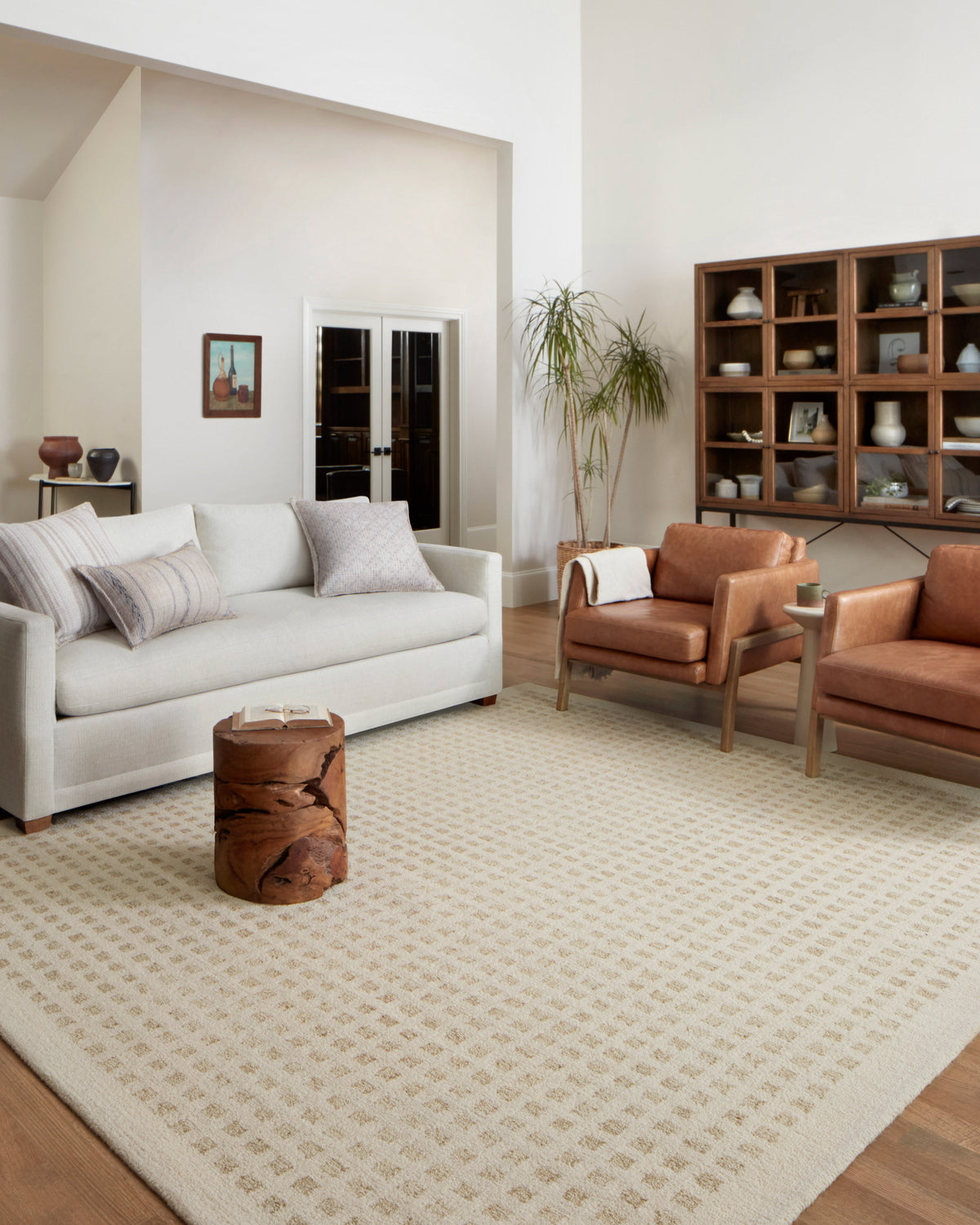 Ivory hand-tufted rug with repeating geometric grid pattern