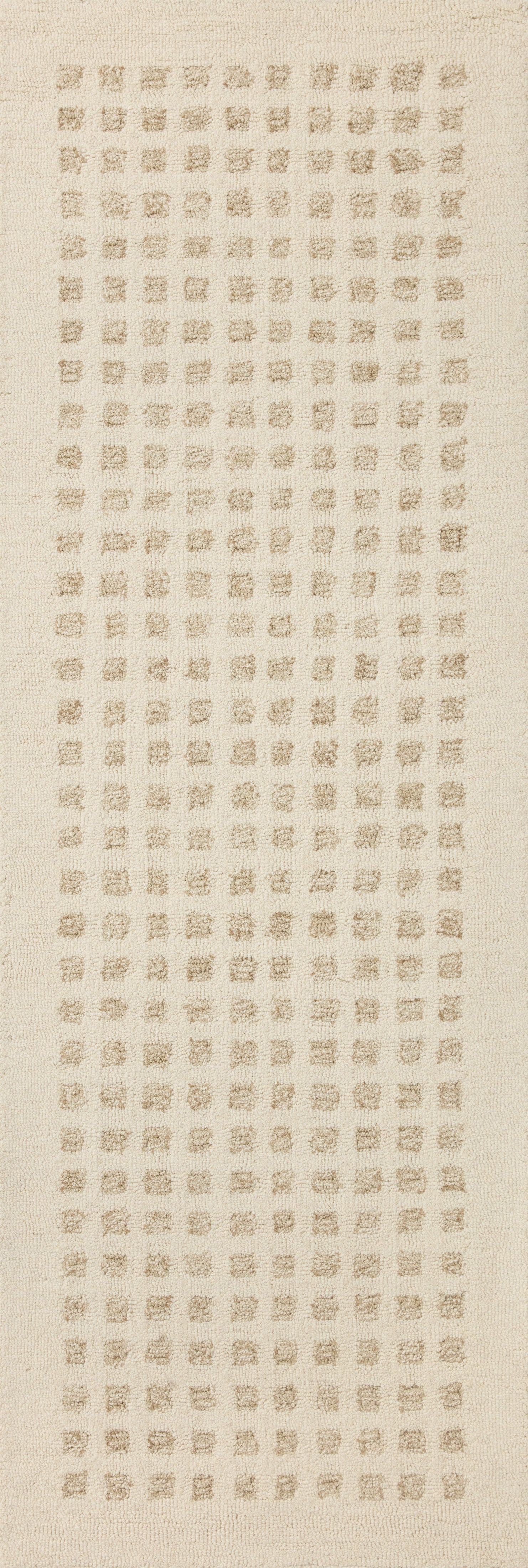 Ivory hand-tufted rug with dense repeating geometric grid pattern