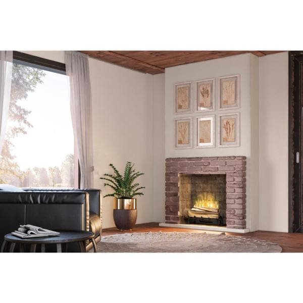 Electric fireplace log set in brick insert with glowing flames