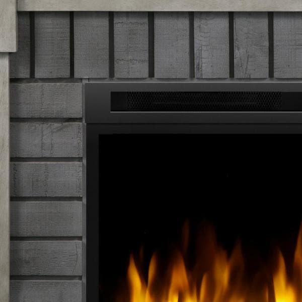 Grey stone-texture mantel surround with flame view through black fireplace opening