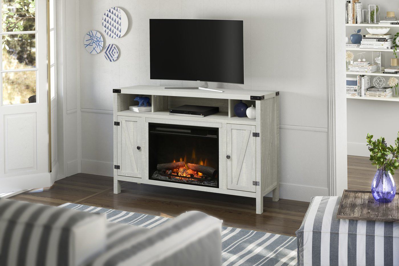 White electric fireplace media console with open center firebox and side cabinet doors