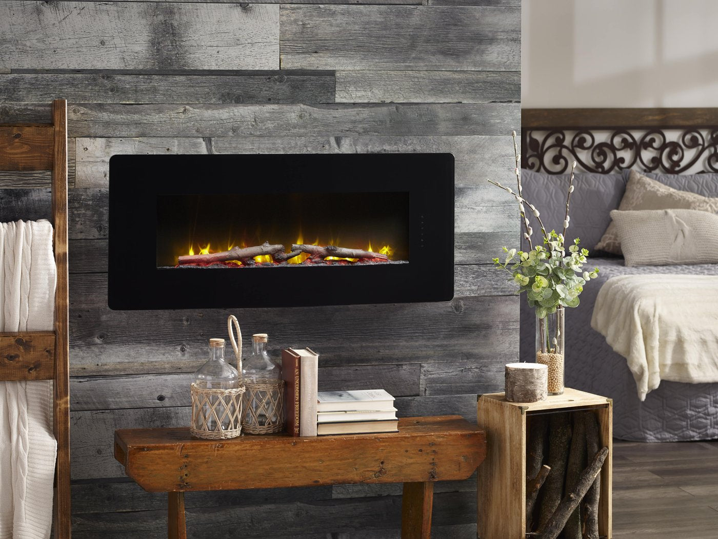 Black wall-mounted linear electric fireplace with ember bed and flame glow