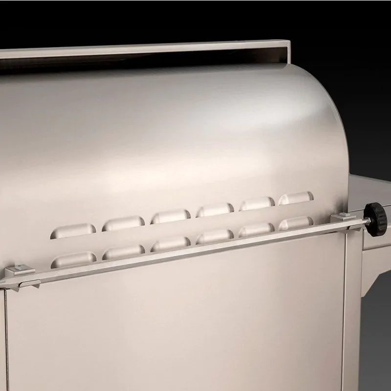 Stainless steel grill lid with control knobs and side vent on natural gas grill