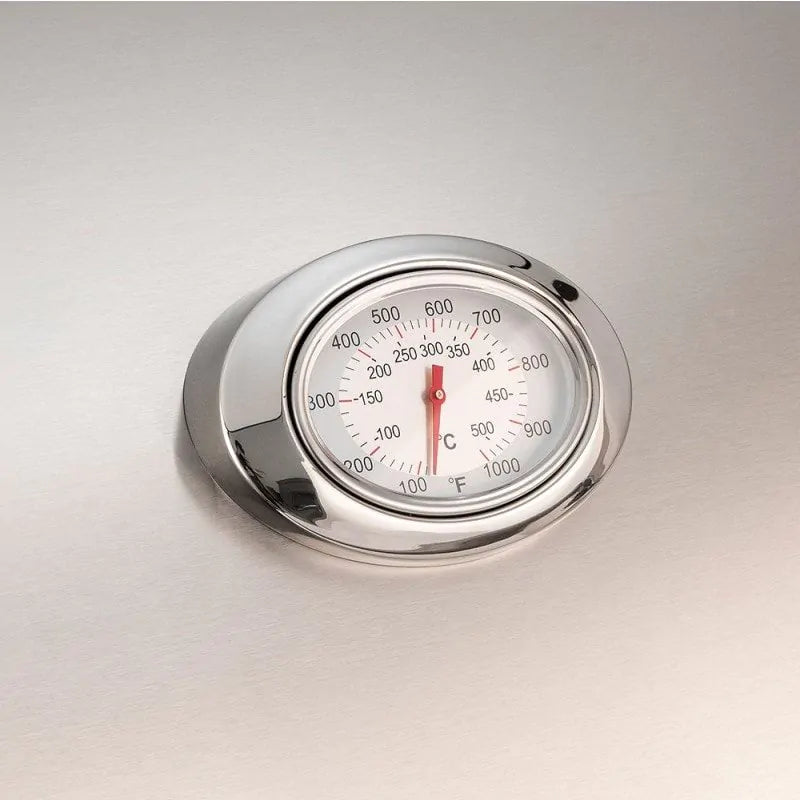 Analog thermometer on stainless grill lid with temperature dial in °F/°C