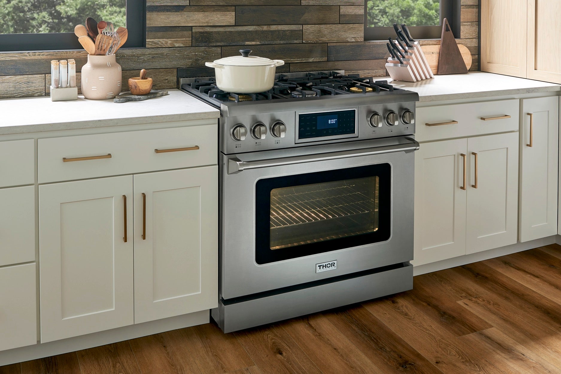 Stainless steel gas range with oven door and tilt control panel