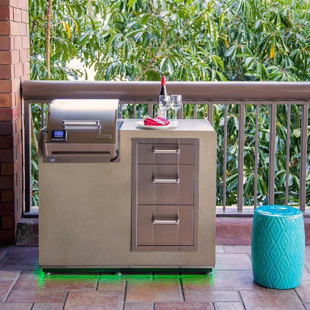 Outdoor built-in electric grill with stainless lid, side shelf, and cabinet doors