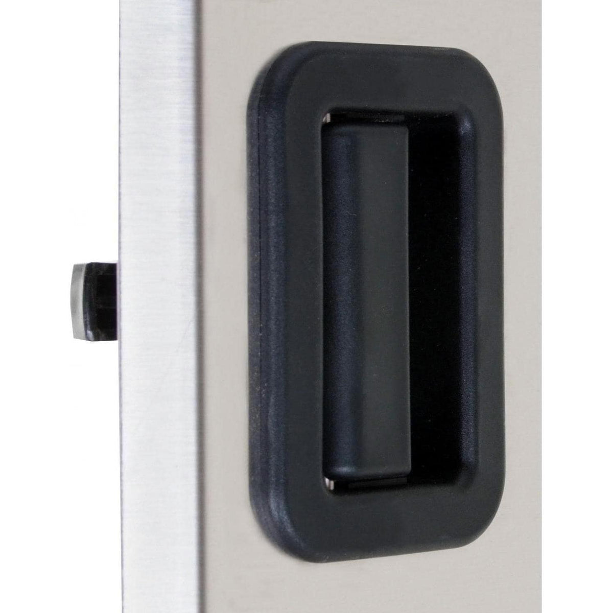 Stainless steel access door handle with dark recessed grip on the door face