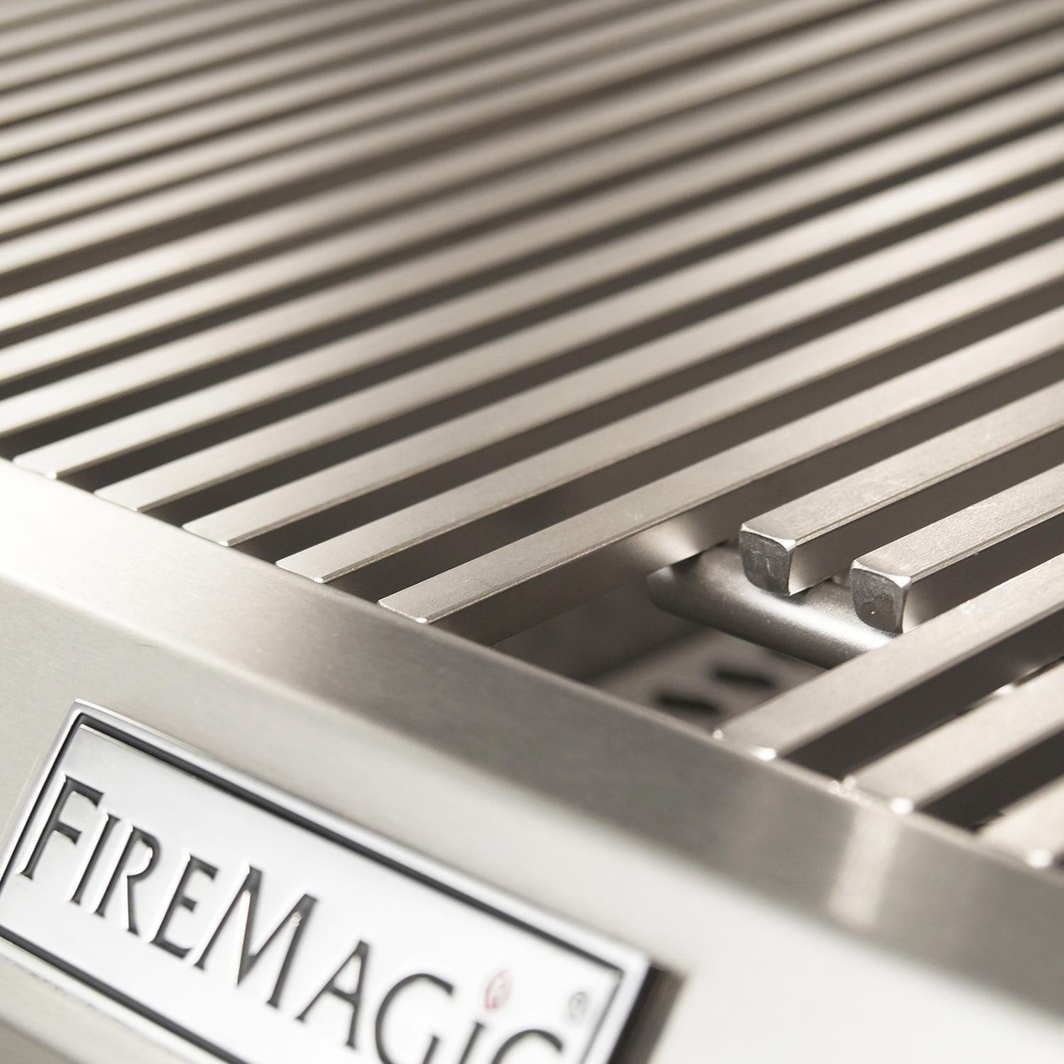 Stainless steel grill grates with FireMagic logo badge on front panel