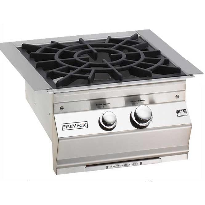 Fire Magic built-in natural gas burner with cast iron grate and control knobs
