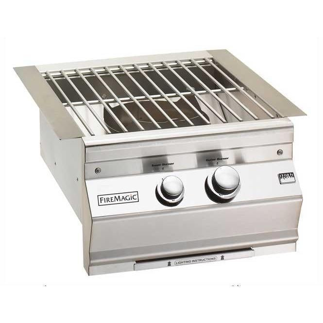 Fire Magic built-in propane gas burner with stainless steel grid and control knobs