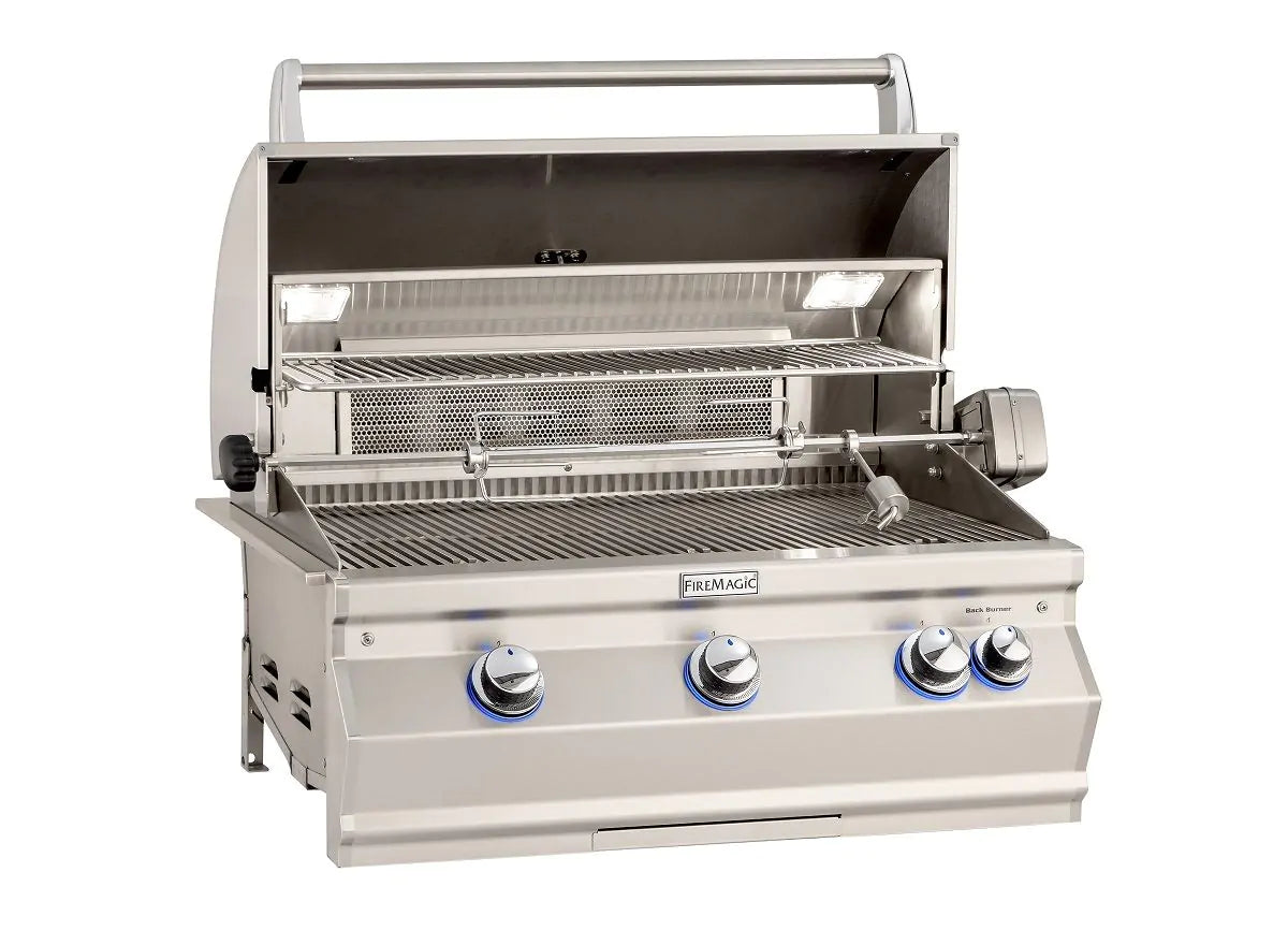 Stainless built-in gas grill with open hood, cooking grates, and burners