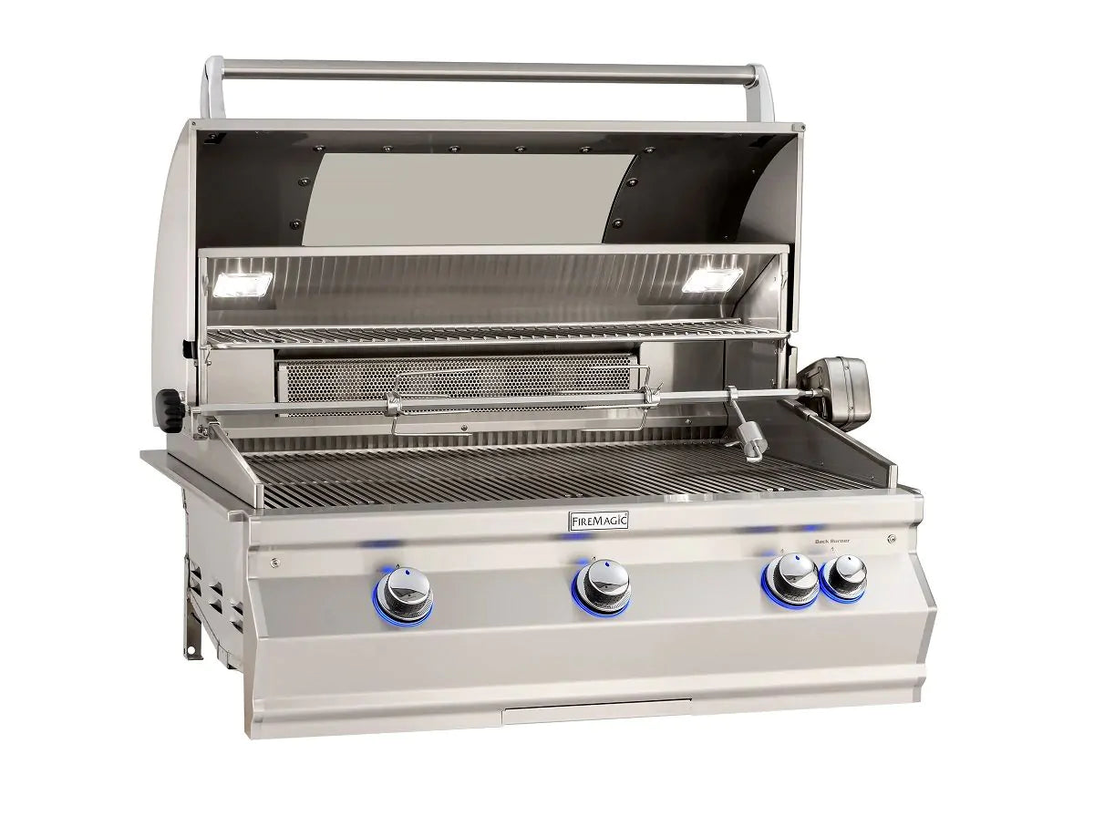 Open stainless steel built-in propane grill with grates and control knobs