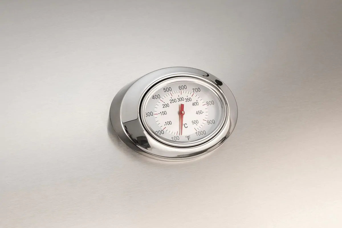Fire Magic analog grill thermometer with temperature dial on stainless hood