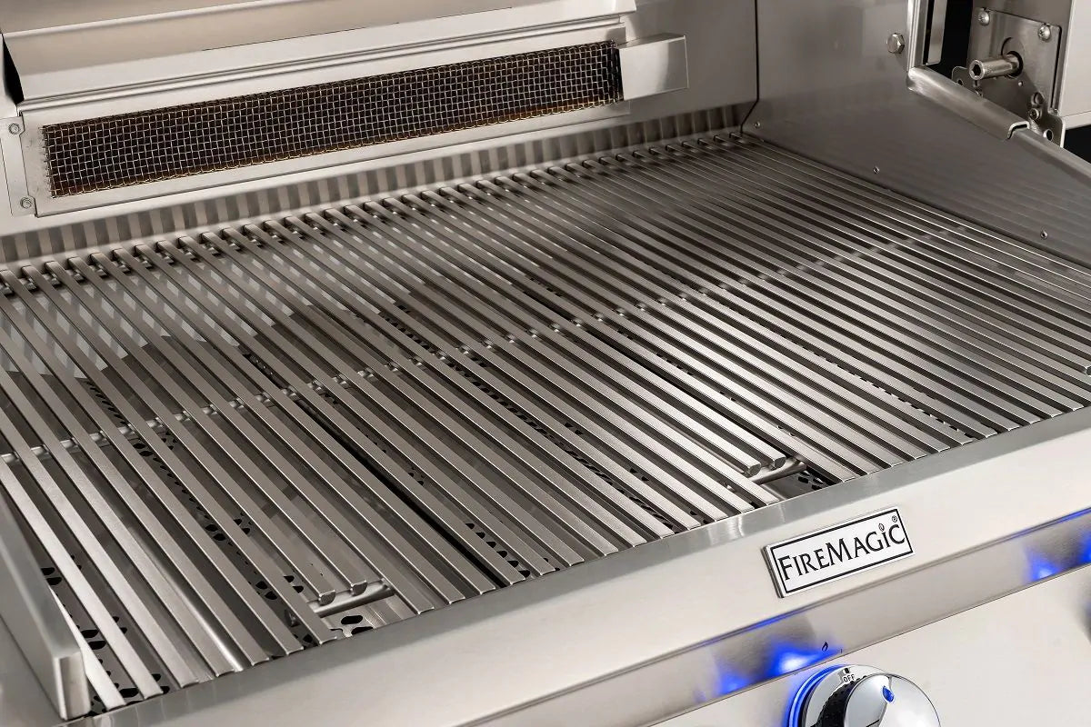 Stainless steel grill grates with black drip tray and brand badge on front panel