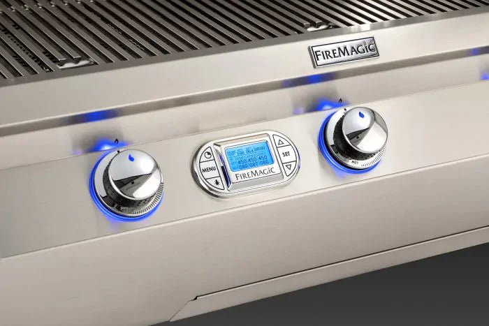 Stainless gas grill control panel with blue flame indicators and digital display
