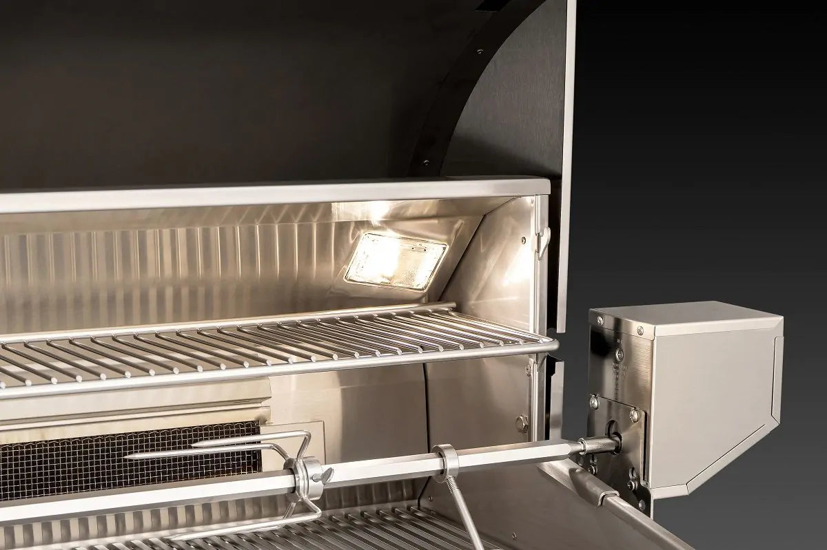 Lit grill hood interior with warming rack and stainless rotisserie motor housing