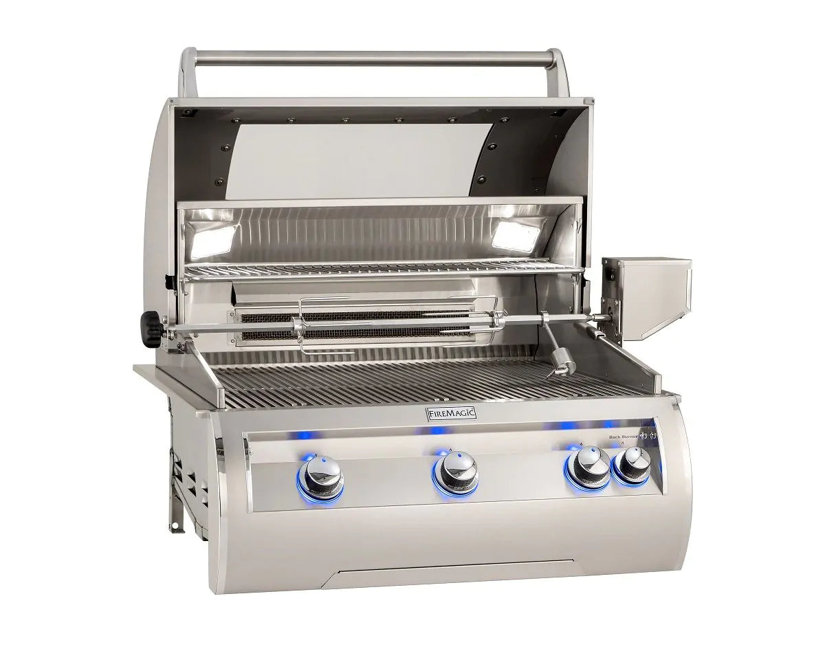 Stainless built-in propane gas grill with open hood and stainless cooking grates