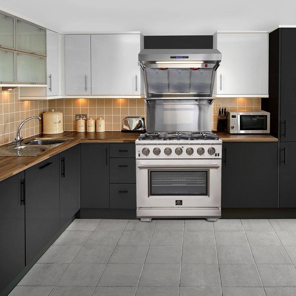 Stainless steel gas range with wall hood in a modern kitchen setup
