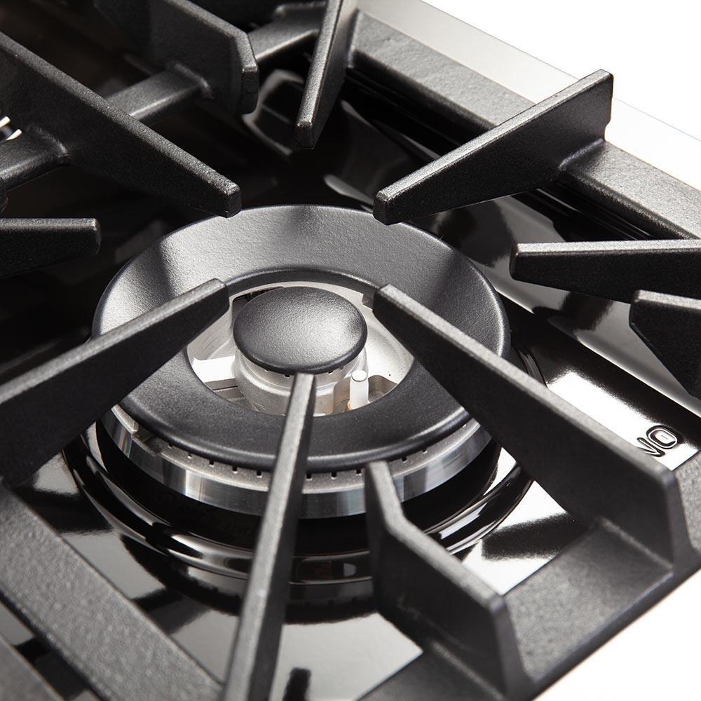 Dual fuel range burner head with black grate and metal burner components