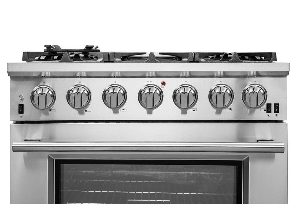 Stainless steel gas range control panel with six burner knobs