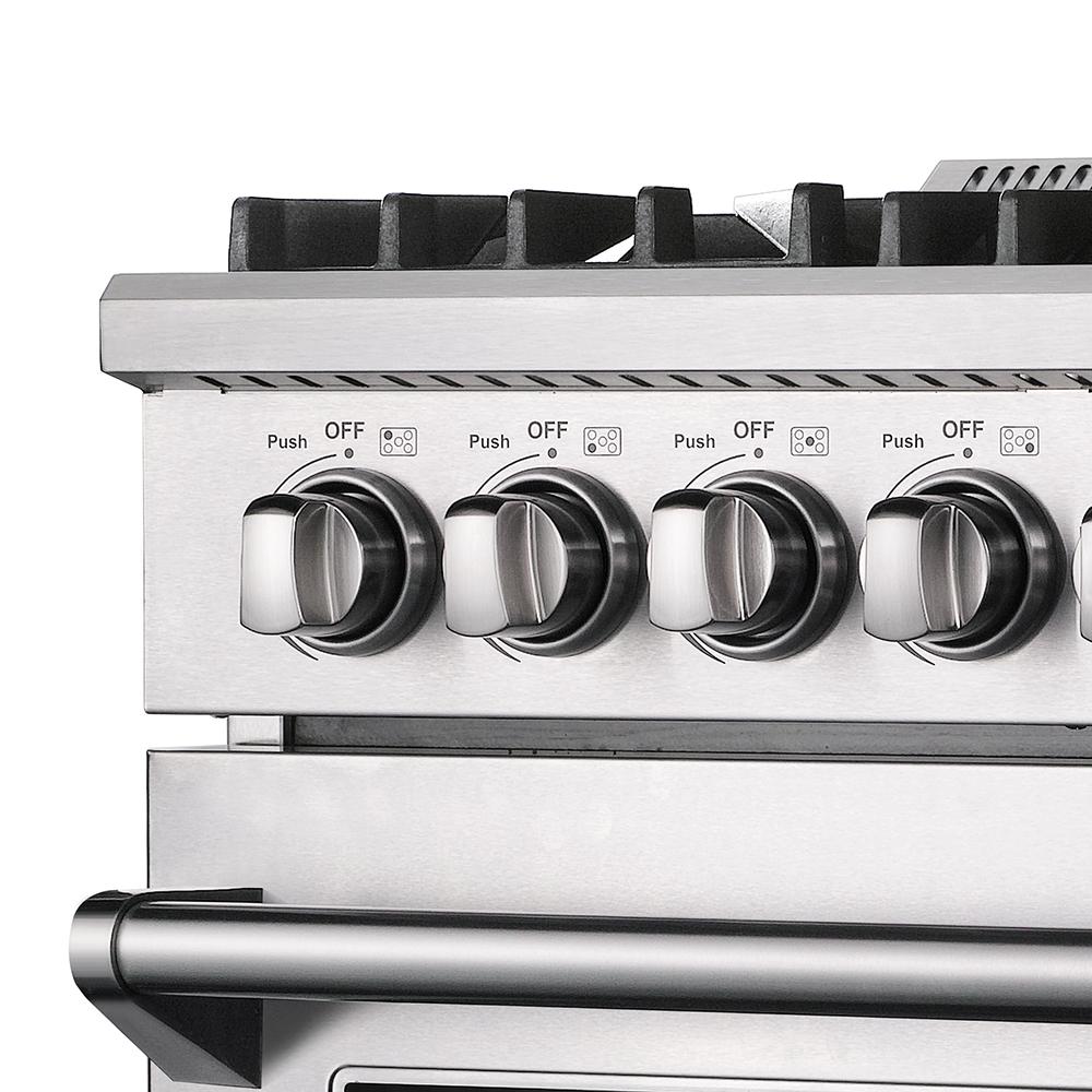 Gas range control knobs with Push and Off markings, stainless front panel