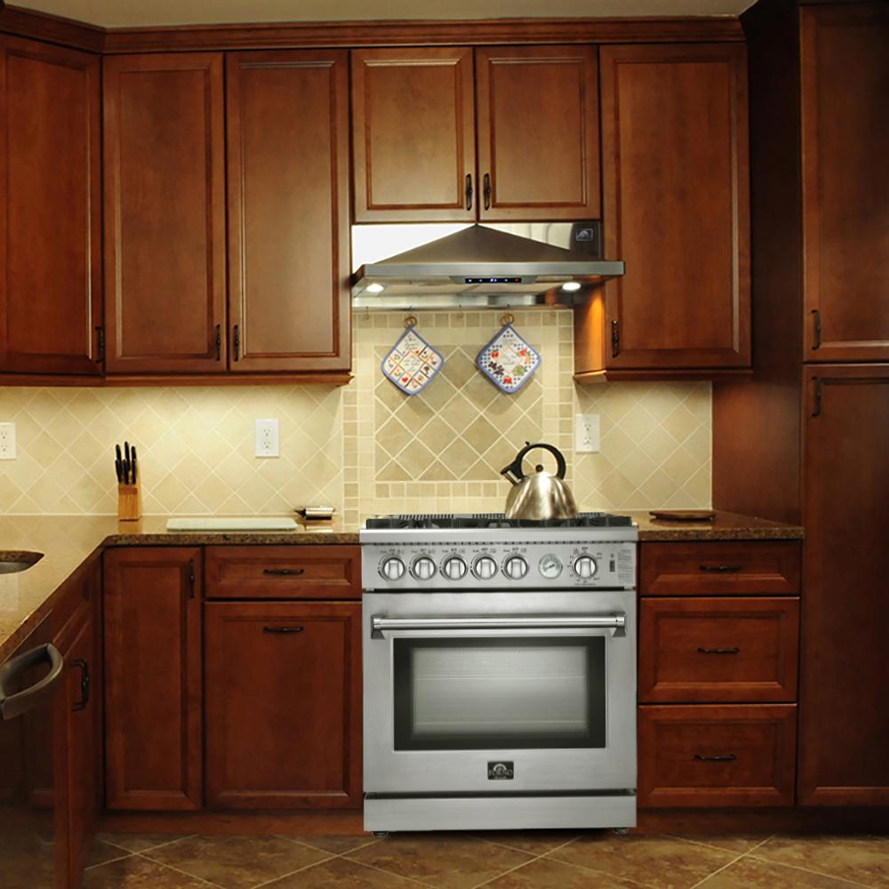 Stainless steel gas range with convection oven and smooth front door, in kitchen