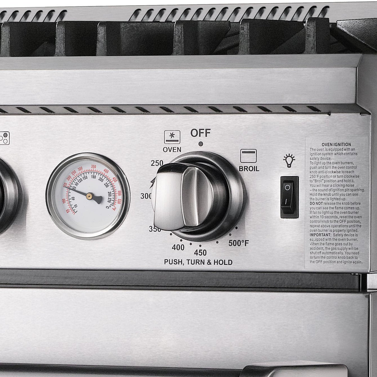 Stainless gas oven control panel with temperature gauge and knobs