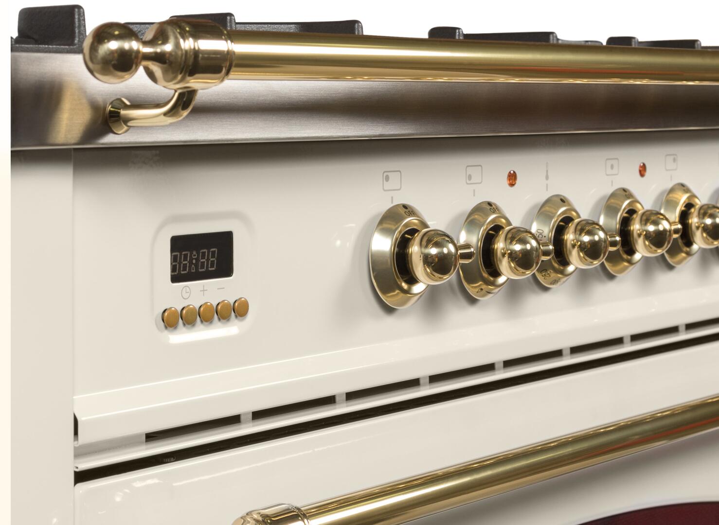 Range control panel with brass knobs and display with antique white finish