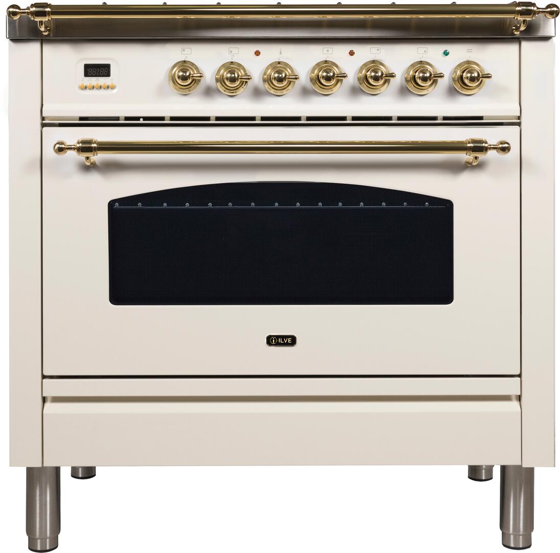 Antique white dual fuel range with brass trim, control knobs, and glass oven door