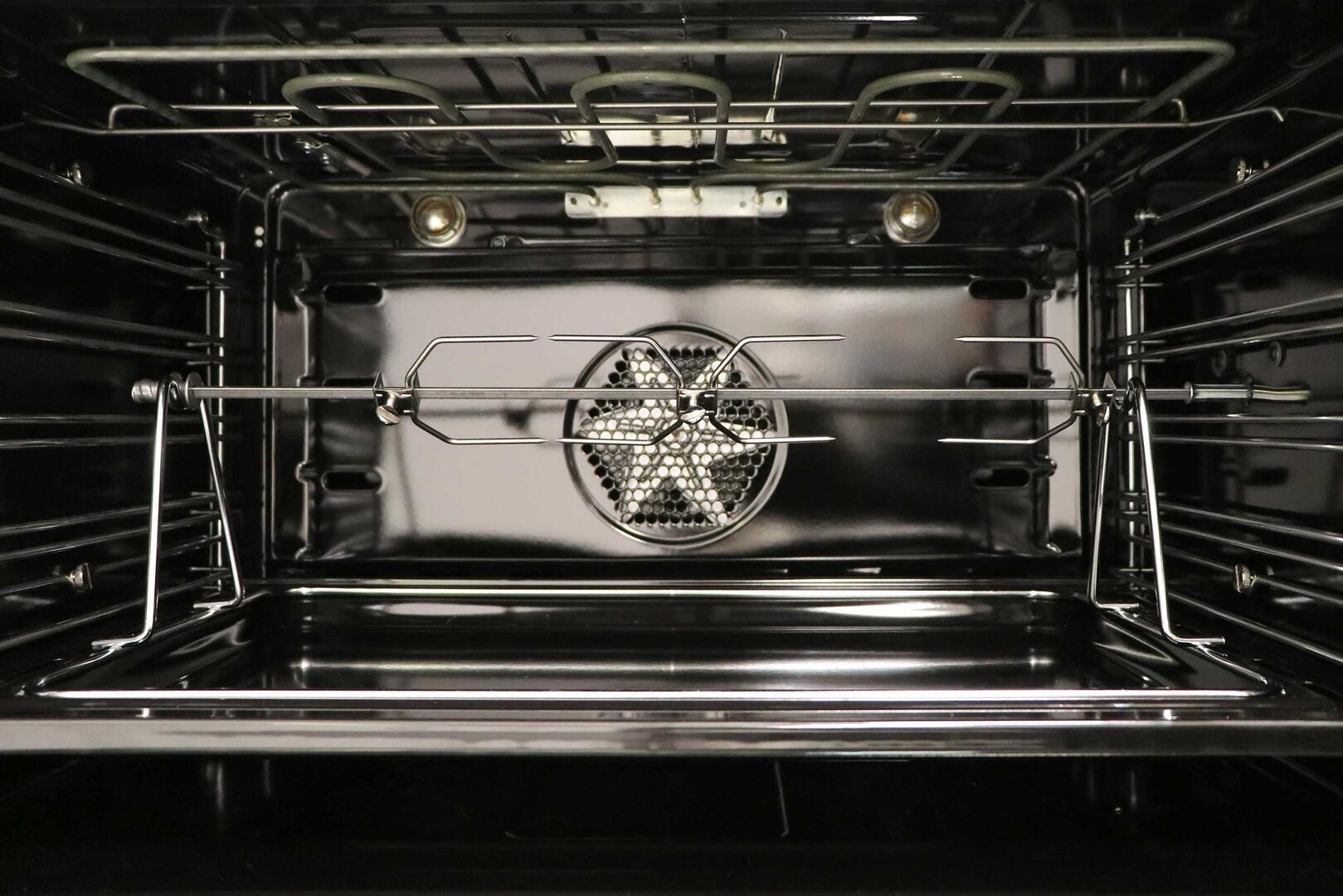 Dual fuel oven interior with center broil shield and chrome oven racks