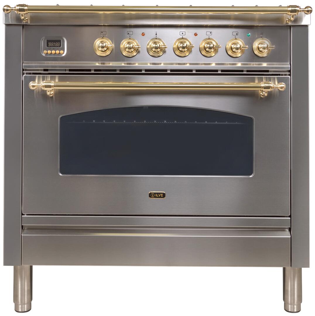 Stainless gas range front with brass rails, control knobs, and black oven window