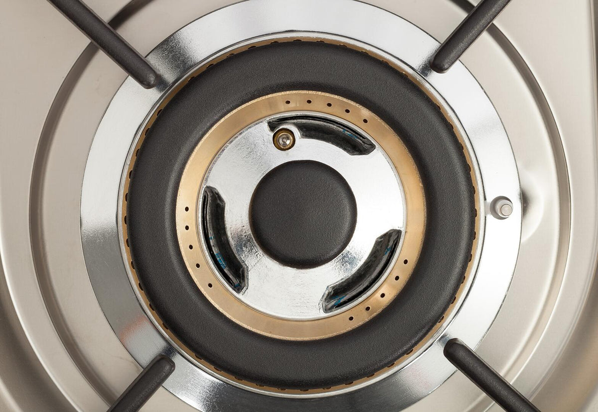Dual-fuel range burner head with black center cap and bronze perforated ring