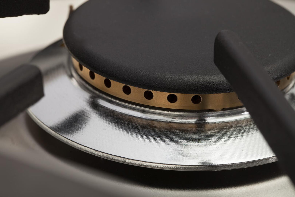 Dual-fuel range burner with bronze trim and black cap on stainless grate