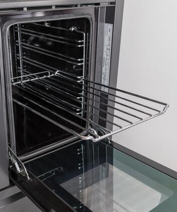 Stainless steel oven wire rack in a small oven, pulled out