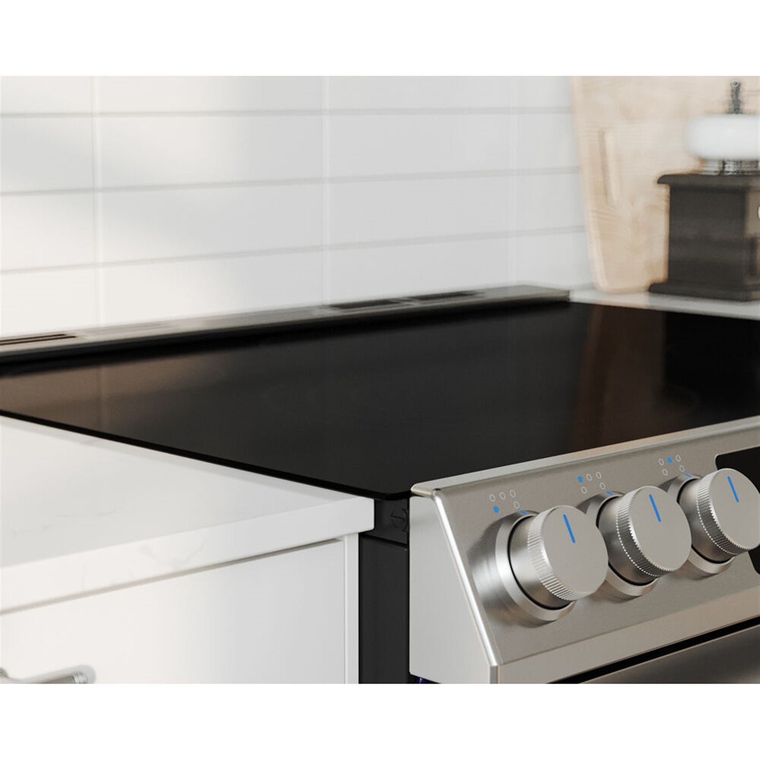 Stainless steel electric slide-in range with black glass cooktop and control knobs