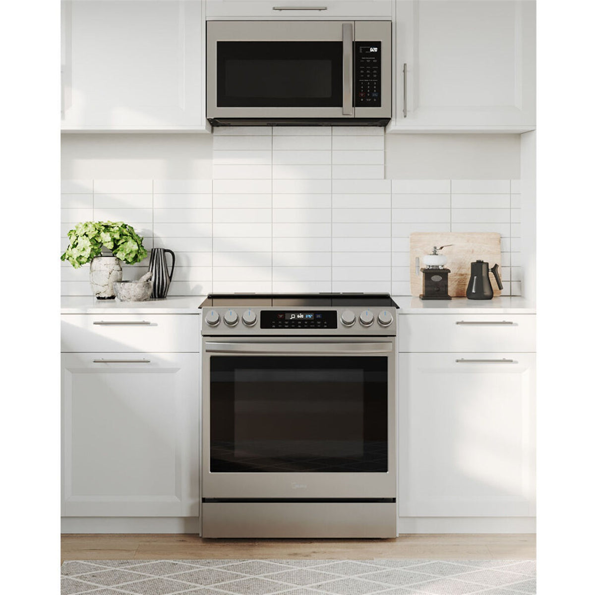 Stainless steel electric range with black cooktop, control panel, and closed oven