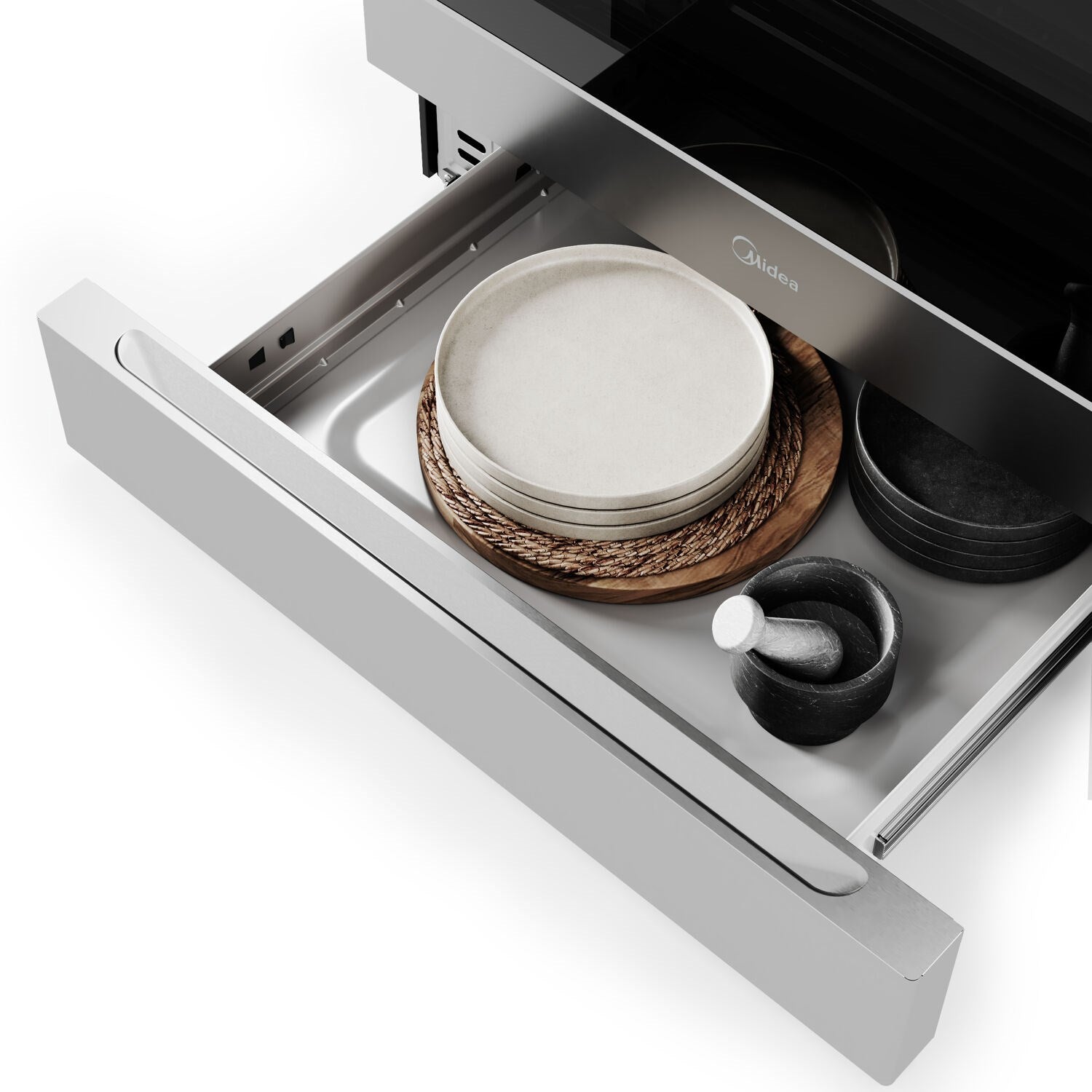 Stainless electric range with pull-out drawer open, holding plates and cookware