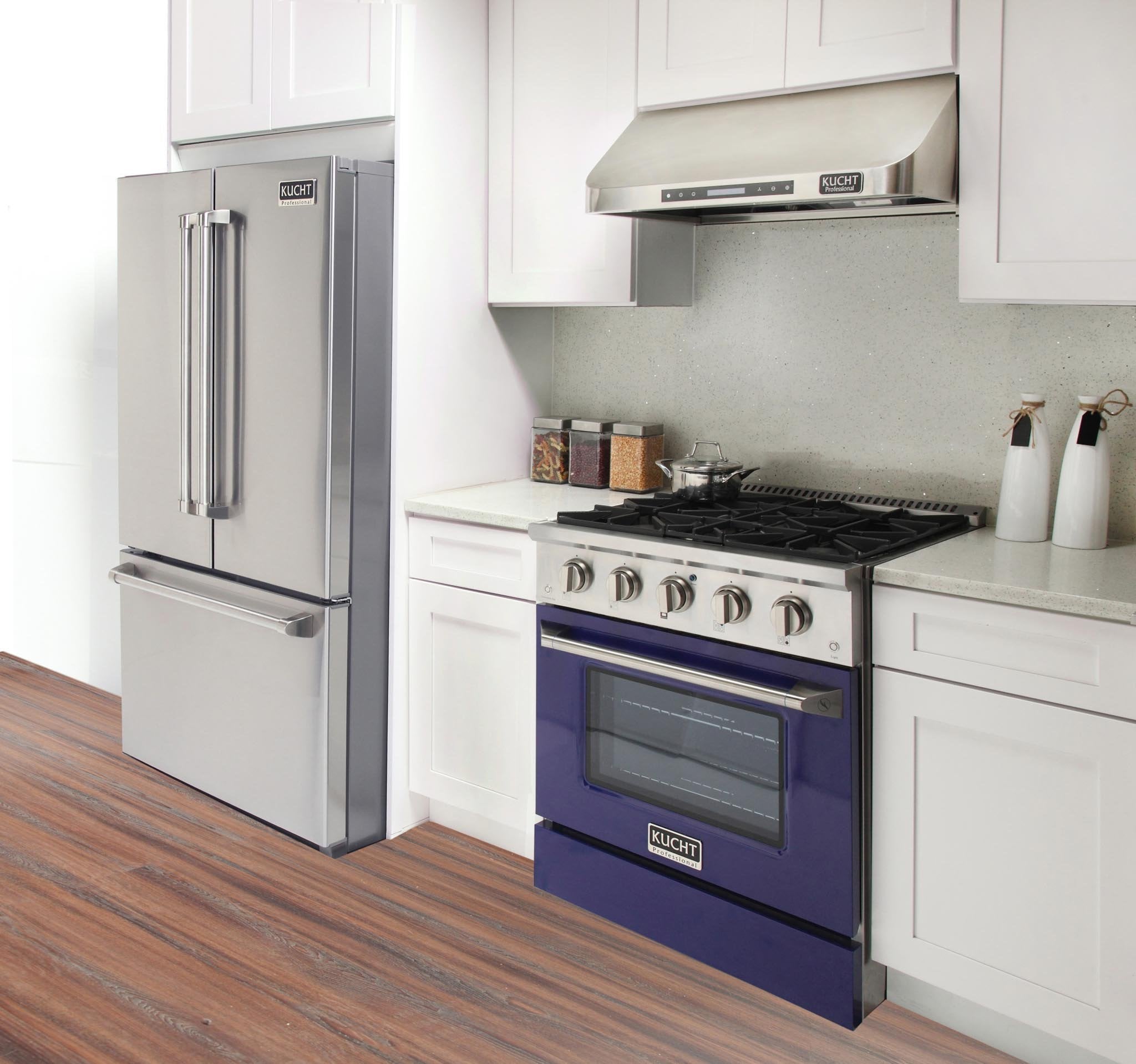 Blue gas range with black grates and windowed oven beneath a kitchen hood