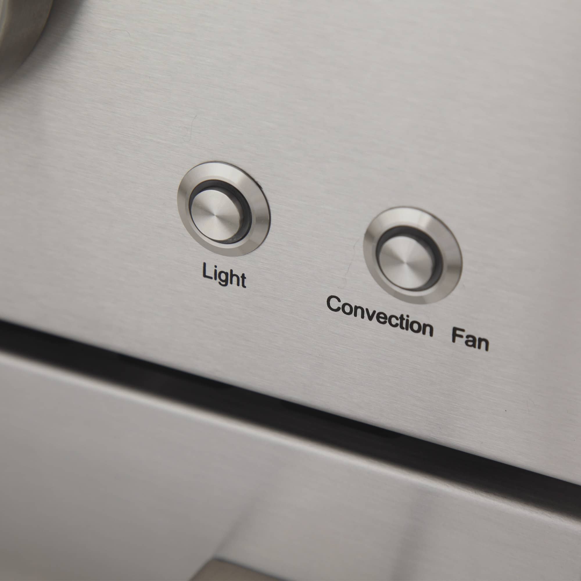 Gas range control area with knobs labeled Light and Convection Fan