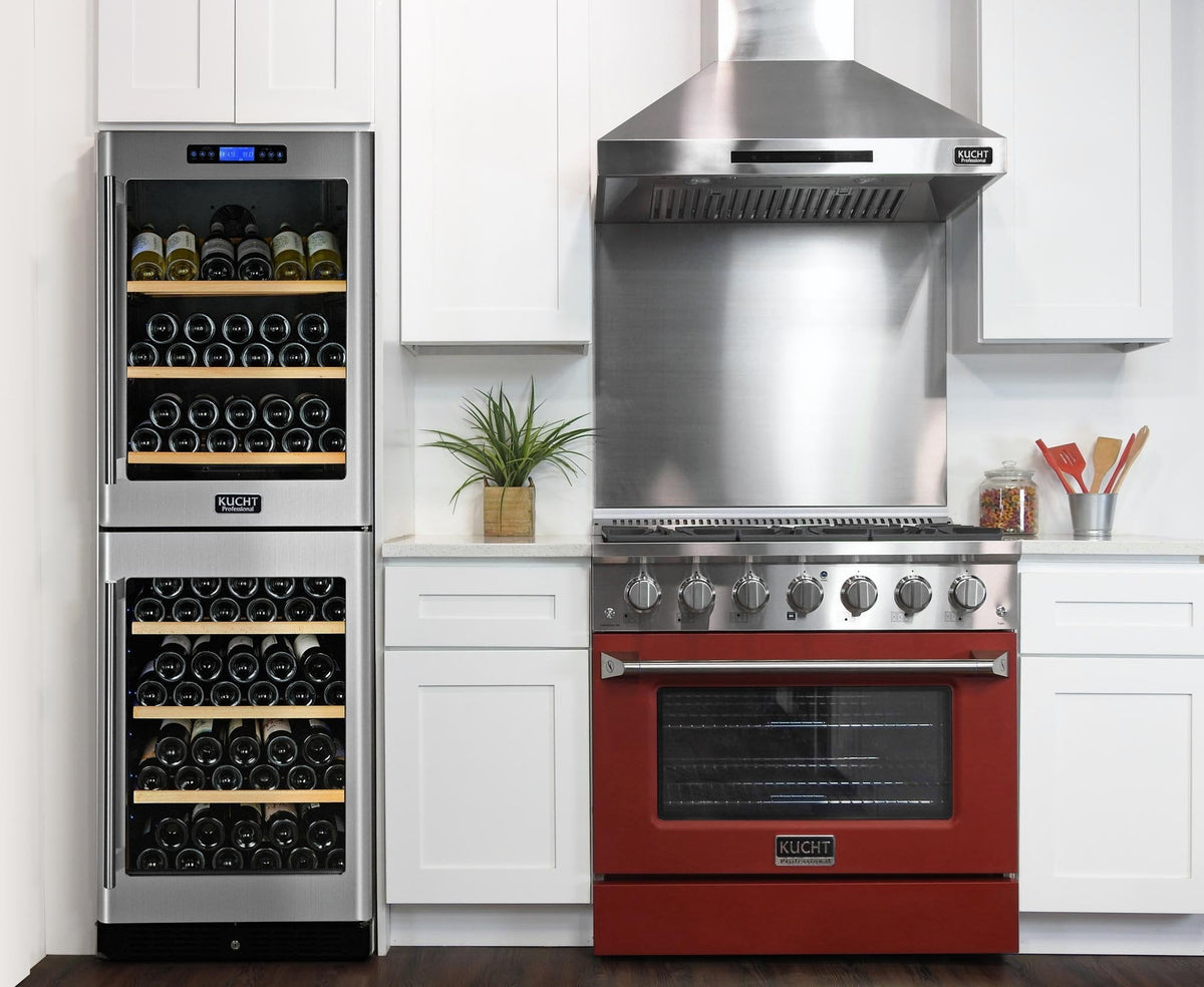 Red gas range with control knobs, black oven door, and stainless vent hood