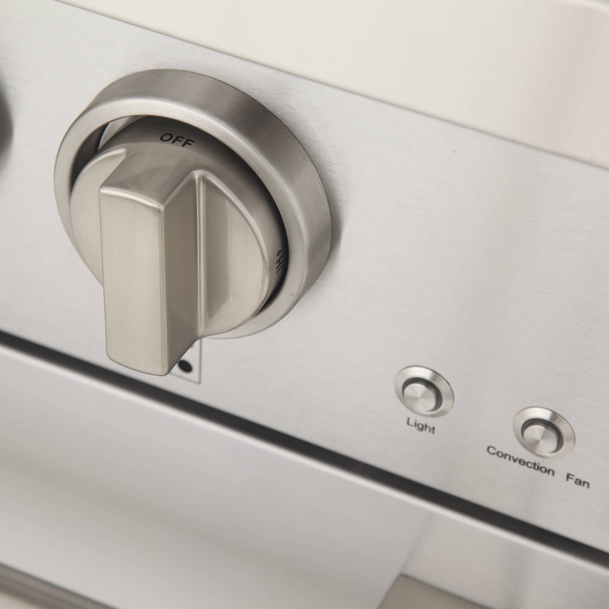 Stainless control dial panel with OFF knob plus labeled Light and Convection Fan buttons