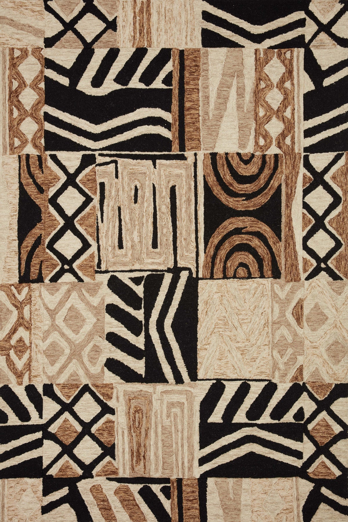 Contemporary hand-tufted rug with abstract geometric patchwork in tobacco, natural, and black.
